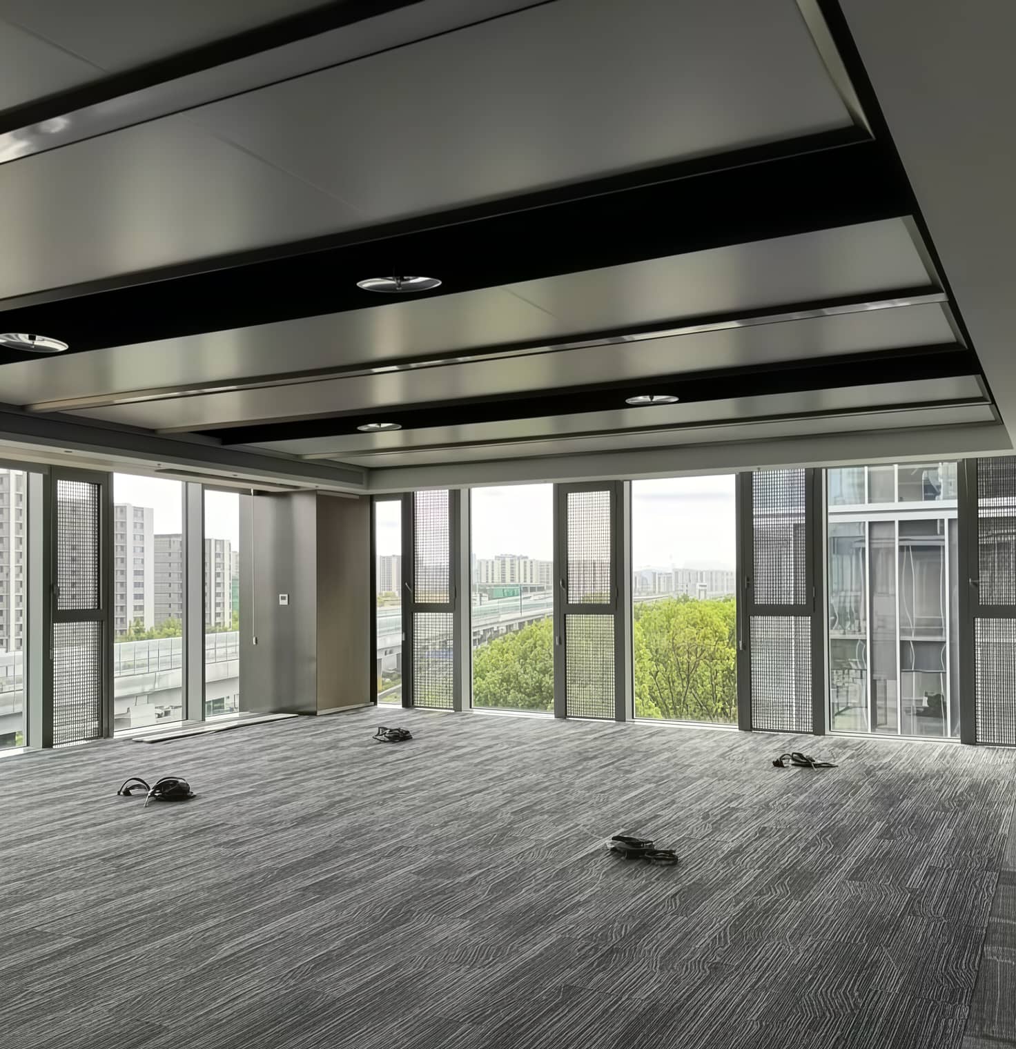 Low Profile Raised Access Floor for Office Wiring with low pedestals and modular panels creating a maintainable cable zone within limited headroom